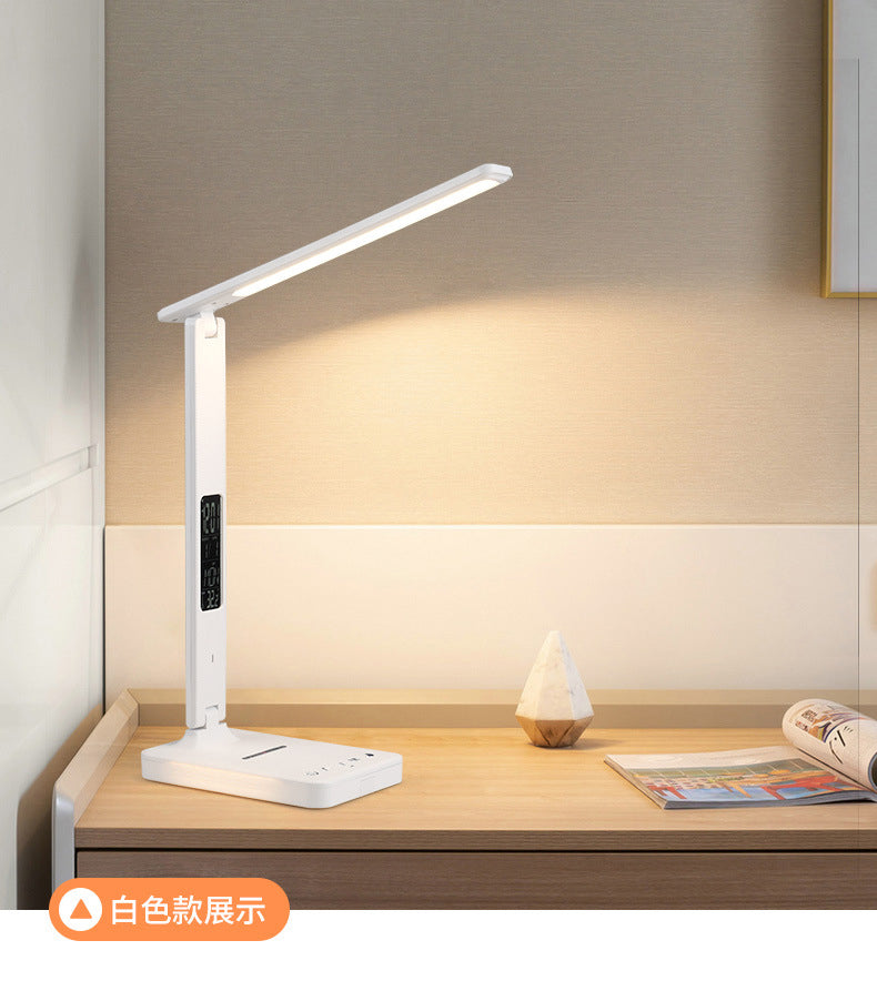 Multifunctional foldable business desk lamp with wireless charging for mobile phones